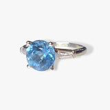 Platinum Round Aquamarine and Tapered Baguette Diamond Three-Stone Ring Side View