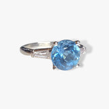 Platinum Round Aquamarine and Tapered Baguette Diamond Three-Stone Ring Side View